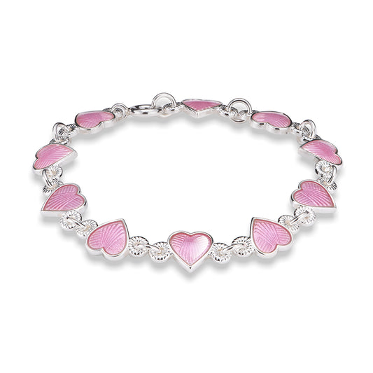 Armbånd i sølv med rosa emaljehjerter